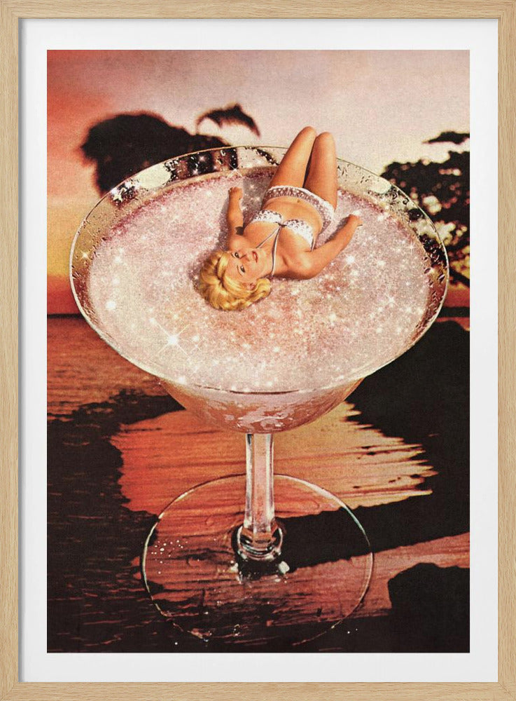 A surreal collage featuring a blonde woman in a white bikini lounging in a giant cocktail glass filled with a sparkling pink liquid, set against a warm sunset over the ocean. Print