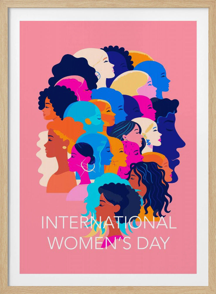 A vibrant poster for International Women's Day featuring a pink background. The central graphic is a collage of colorful profiles of diverse women, representing different ethnicities and hairstyles, all looking in the same direction. Below the illustration, white text reads 'INTERNATIONAL WOMEN'S DAY'. Wall Art