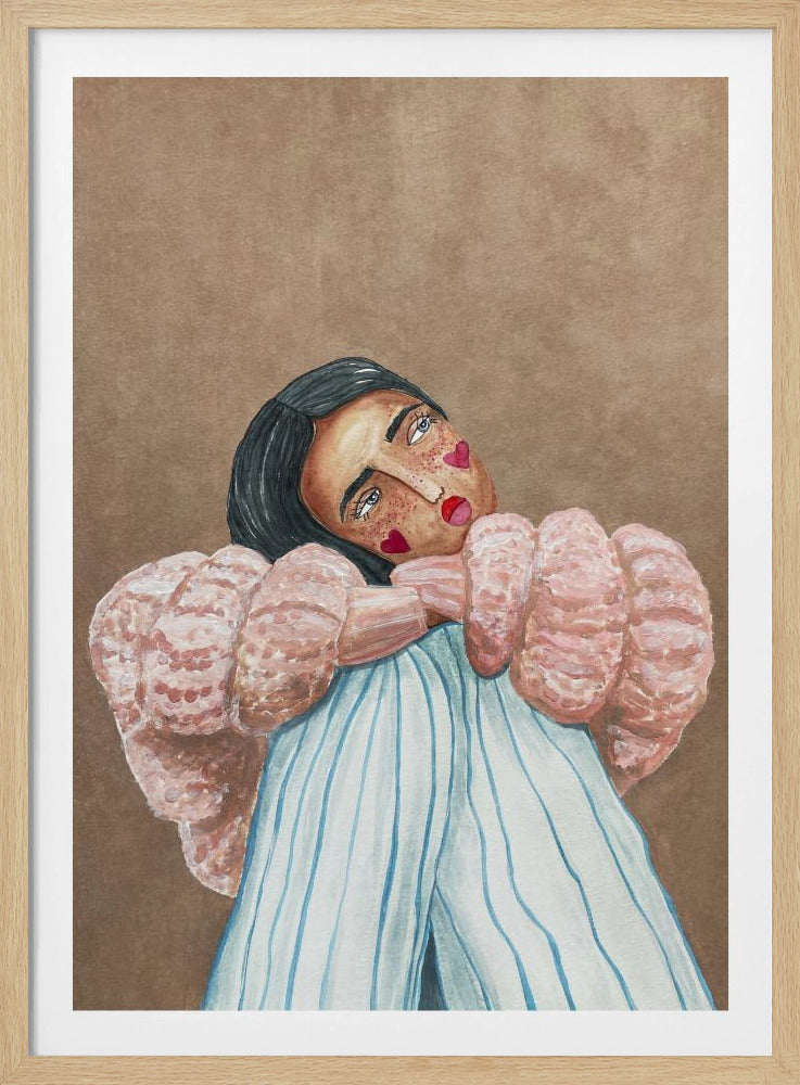 An illustrative painting of a person with dark hair, freckles, and red heart stickers on their cheeks. They are wearing a textured pink sweater and light blue pinstripe pants, hugging their knees while looking at the viewer with their head tilted against a solid brown background. Wall Art