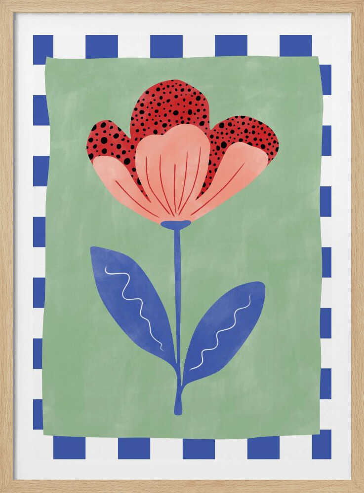 A framed illustration of a stylized flower with red polka-dotted and pink petals. The flower has a blue stem and two blue leaves, set against a sage green background with a blue and white checkered border. Artwork
