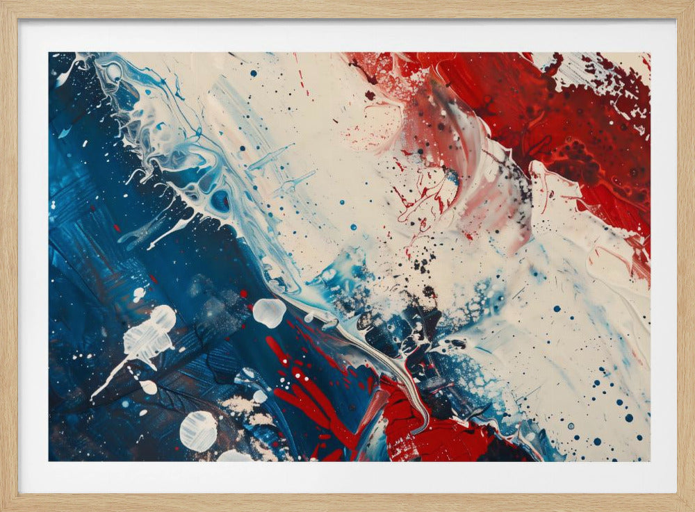 A close-up of an abstract painting in a silver frame, featuring a dynamic composition of red, white, and blue. Thick strokes of paint are splattered and swirled across the canvas, with a large area of deep blue on the left, a bold patch of bright red on the upper right, and a field of off-white in the middle. The piece has a textured, energetic quality. Artwork