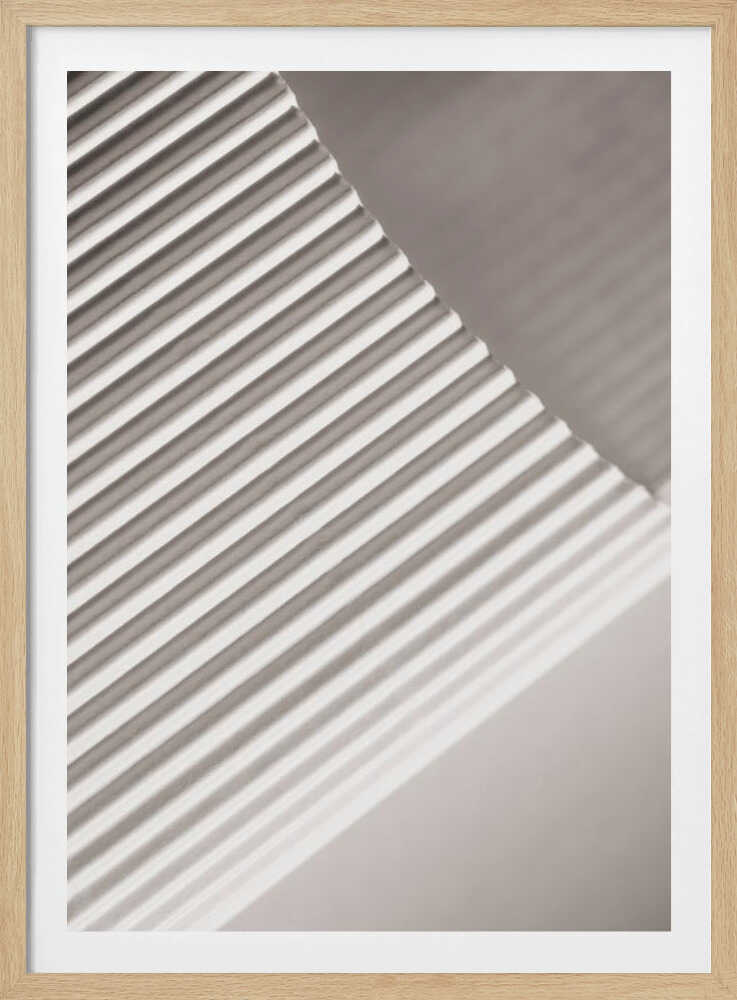 Abstract photograph of a ribbed surface with diagonal lines created by light and shadow, minimalist wall art.