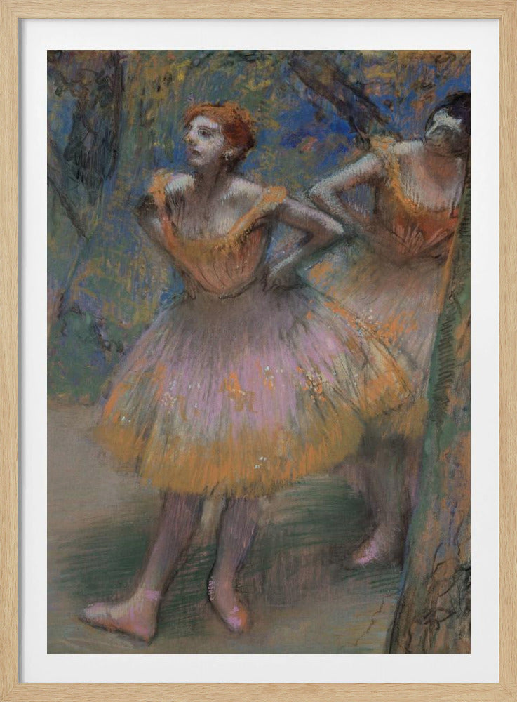 An impressionist pastel painting by Edgar Degas of two ballet dancers. The main dancer in the foreground has red hair and wears a pink and orange tutu. She stands with her hands on her hips, looking off to the left. The background is a blend of blue and green strokes, suggesting a backstage or outdoor setting. Decor