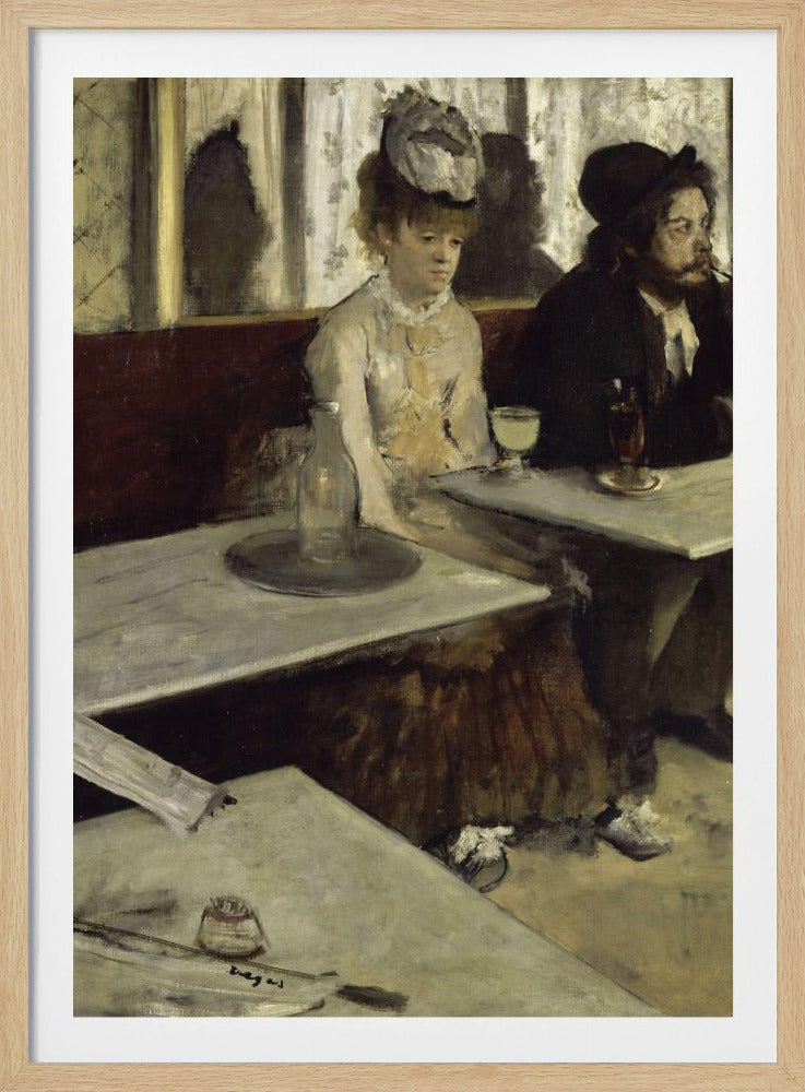 An impressionist painting by Edgar Degas, 'L'Absinthe', depicting a man and a woman sitting separately in a cafe. The woman in a light dress and hat looks downcast before a glass of pale green absinthe, while the bearded man next to her smokes a pipe and looks to the right. The scene is captured from an angle, with empty cafe tables in the foreground. Poster