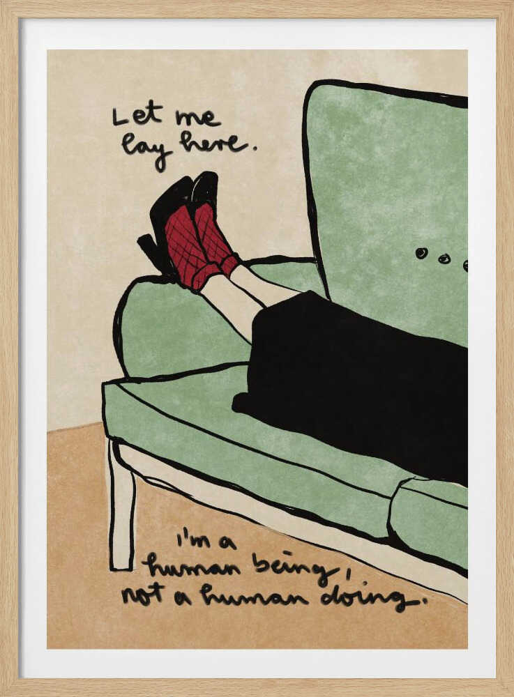 An illustration of a person's lower legs and feet propped up on a sage green armchair. The person wears red patterned socks and black high heels. Handwritten text above the feet reads, 'Let me lay here.' and text at the bottom reads, 'I'm a human being, not a human doing.' The background is a neutral beige, and the artwork has a simple, hand-drawn style with black outlines. Decor