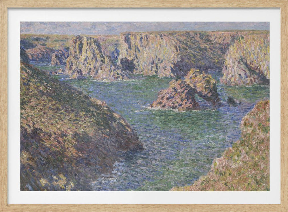 An impressionist painting by Claude Monet of a rugged coastline. Steep, sun-drenched cliffs surround a bay of choppy blue-green water. In the center, a large rock formation features a natural arch. The entire scene is rendered with visible, textured brushstrokes and is enclosed in a silver frame. Artwork