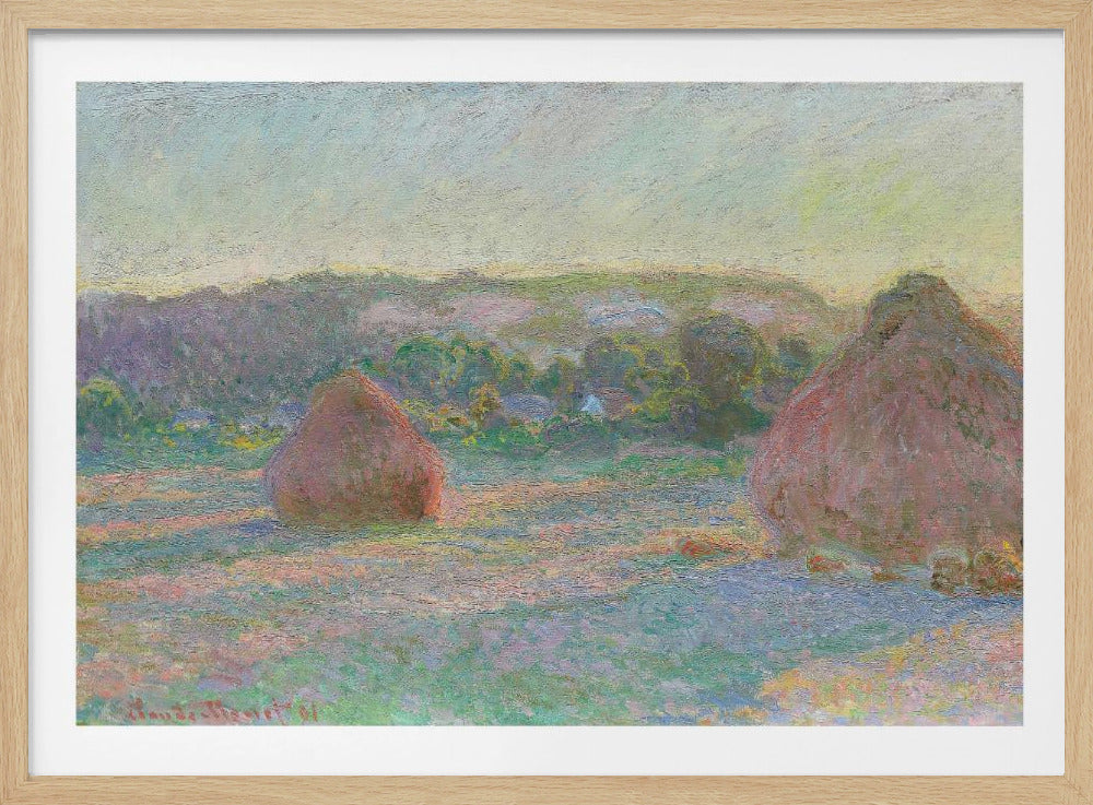 An Impressionist painting by Claude Monet depicting two large, reddish haystacks in a field of green and purple hues during sunrise, with a line of distant trees under a pale yellow sky, all within a silver frame. Poster