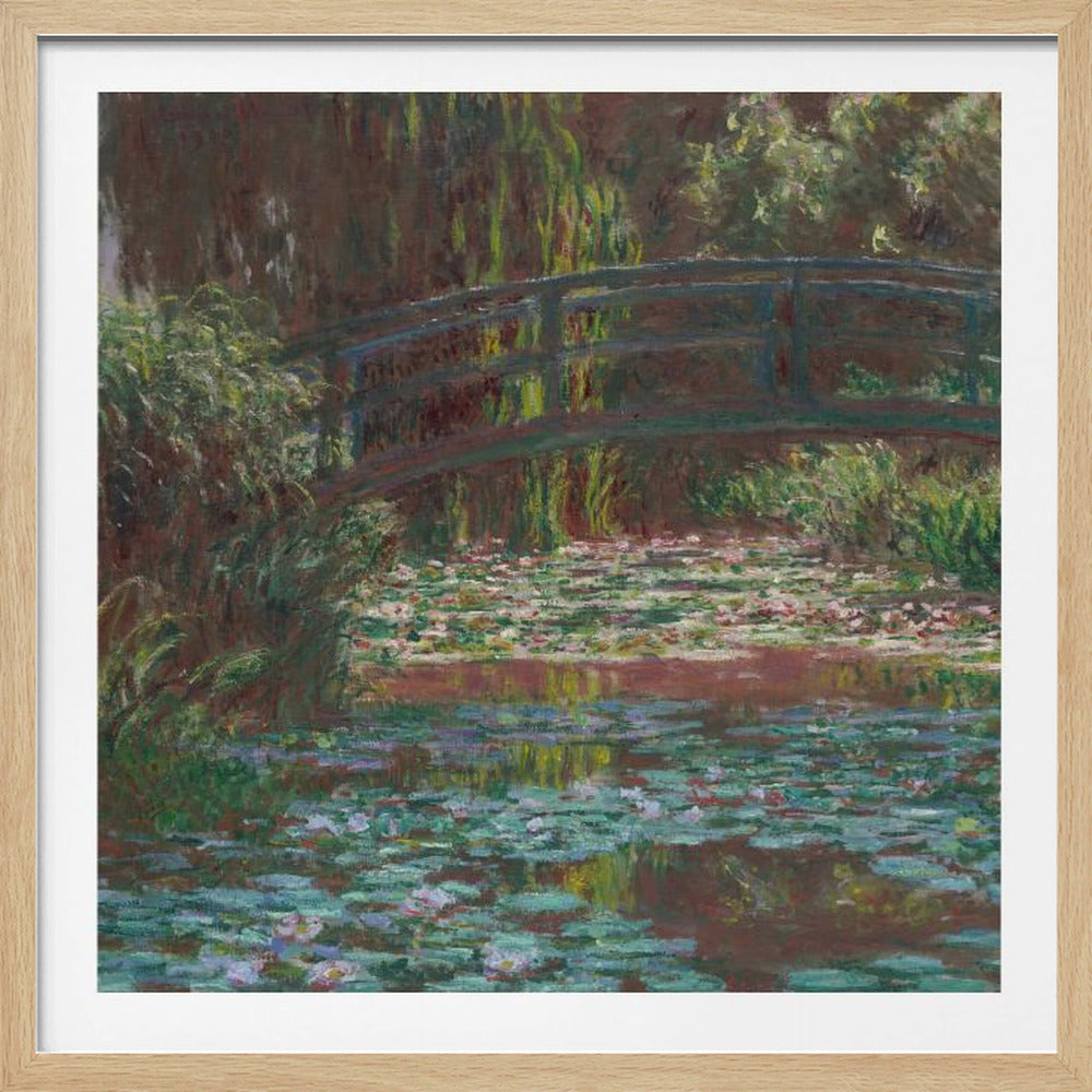 An impressionist painting by Claude Monet of the Japanese bridge over his water lily pond. The artwork, framed in light wood, is rich with shades of green from the foliage and lily pads, and deep brown and blue tones in the water and the bridge itself. Wall Art