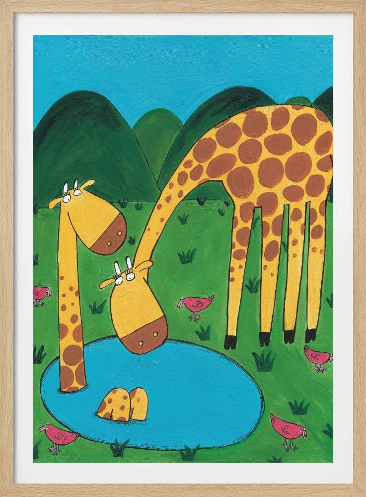 A whimsical, cartoon-style painting of three giraffes at a watering hole in a green, hilly landscape. One large giraffe bends down to drink, another giraffe is partially submerged in the pond, and a third smaller giraffe looks on, surrounded by small pink birds. Decor