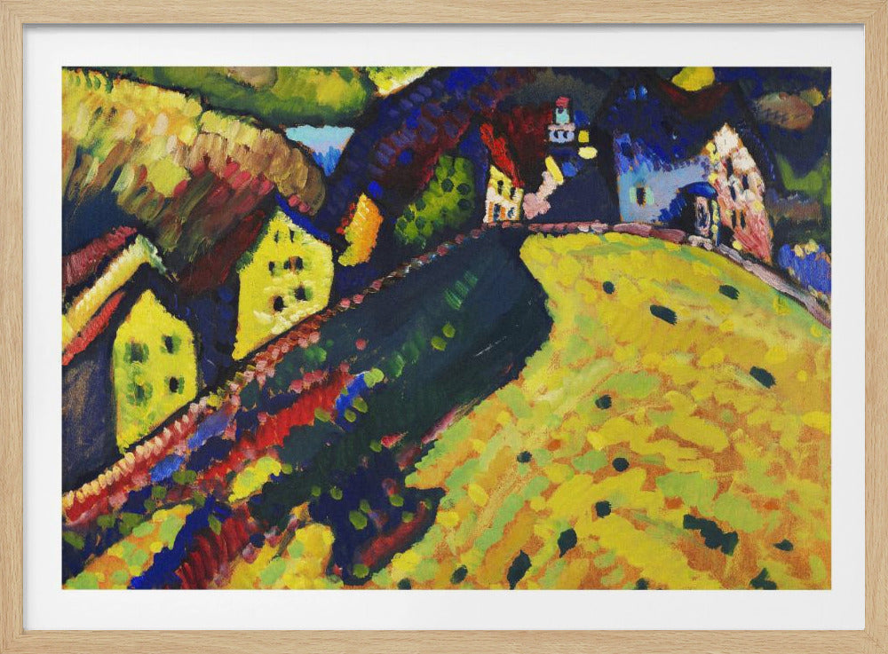 An abstract expressionist painting by Wassily Kandinsky depicting a vibrant, hilly village scene. A bright yellow hill dominates the foreground, contrasted by a dark diagonal path and colorful houses in shades of yellow, blue, and red nestled in the background under a dark sky. The artwork is presented in a silver frame. Poster