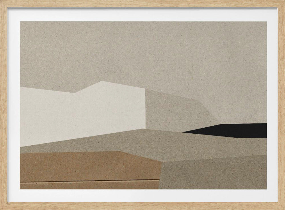 An abstract geometric collage in a silver frame. The artwork is composed of layered, textured paper in various shades of beige, brown, and tan, creating an angular, landscape-like composition with a single black shape on the right. Decor