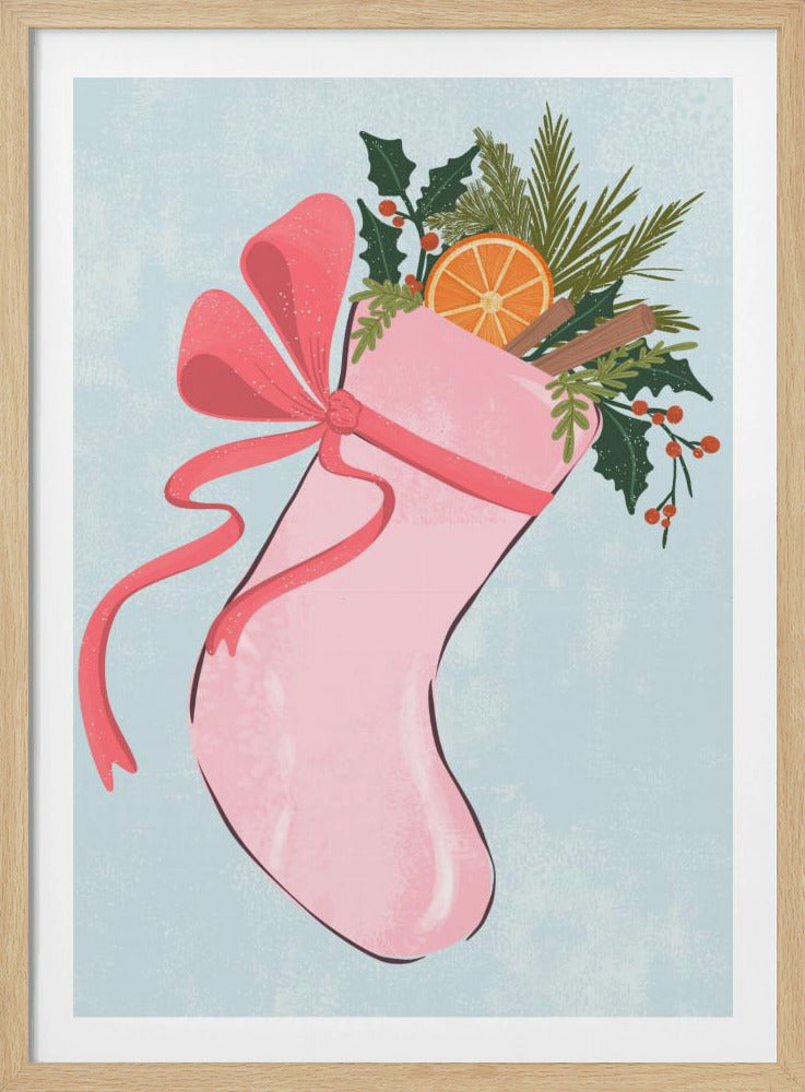 A festive illustration of a pink Christmas stocking against a light blue textured background. The stocking is tied with a large pink ribbon and is filled with holiday greenery, including holly with red berries, pine needles, a slice of dried orange, and cinnamon sticks. Decor