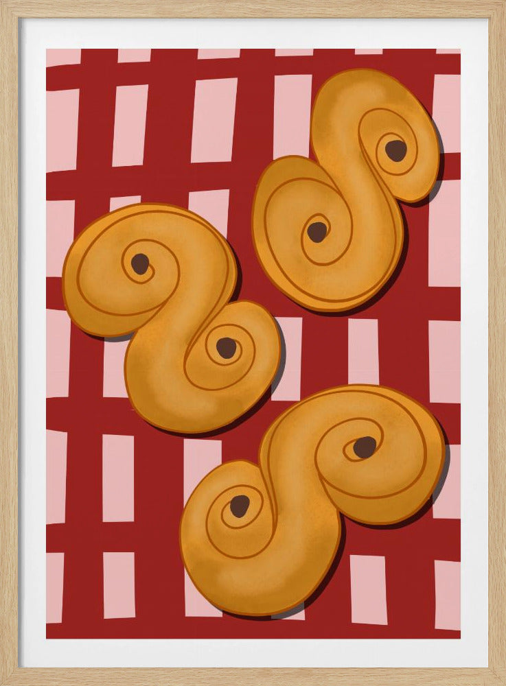 A vibrant illustration of three golden-yellow S-shaped pastries, resembling Swedish saffron buns, resting on a red and pink checkered tablecloth. The artwork is presented within a black frame. Decor