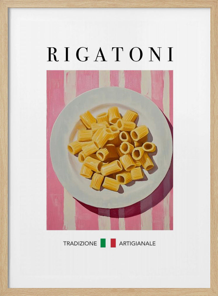 A framed art print of a vintage-style Italian food poster. It features a painting of a white plate full of uncooked rigatoni pasta on a pink and white striped background. The word 'RIGATONI' is printed in large black letters at the top, and 'TRADIZIONE ARTIGIANALE' with a small Italian flag is printed at the bottom. Artwork