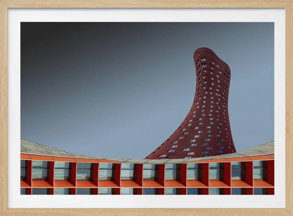A modern architectural photograph showing a curved, maroon skyscraper twisting towards the sky against a gradient grey background. A lower, orange, grid-like building curves along the bottom of the frame. The entire scene is enclosed in a silver frame. Poster