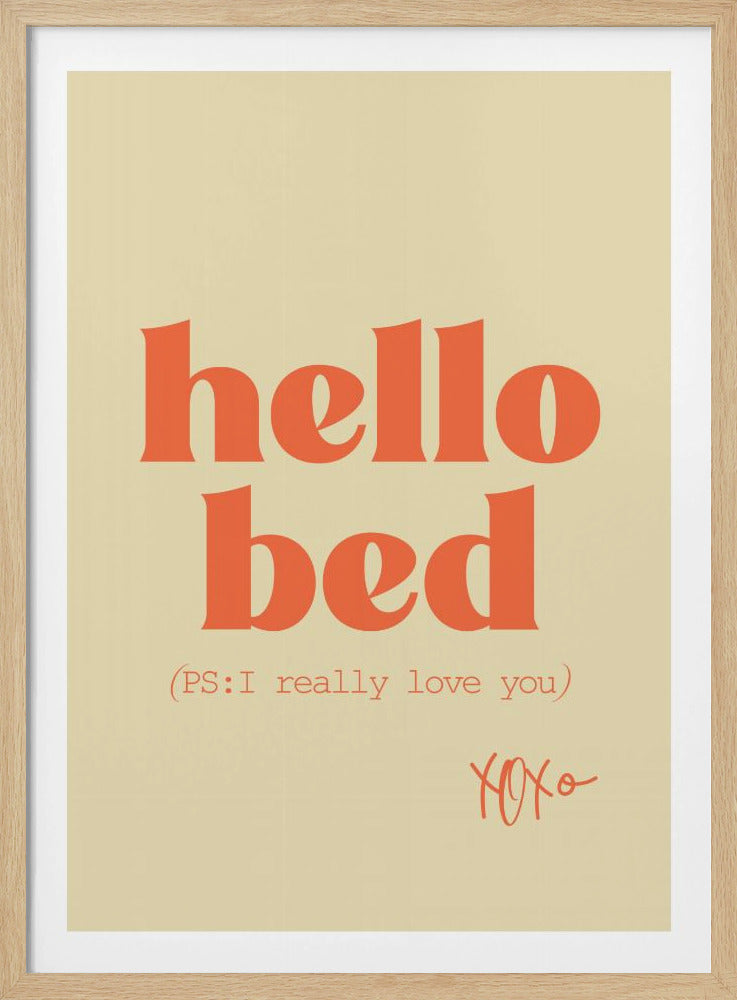 A framed art print with a cream-colored background. The words 'hello bed' are printed in a large, bold, orange serif font. Below this, in a smaller orange font, it reads '(PS: I really love you)'. In the bottom right corner, 'XOXO' is written in an orange script font. Decor