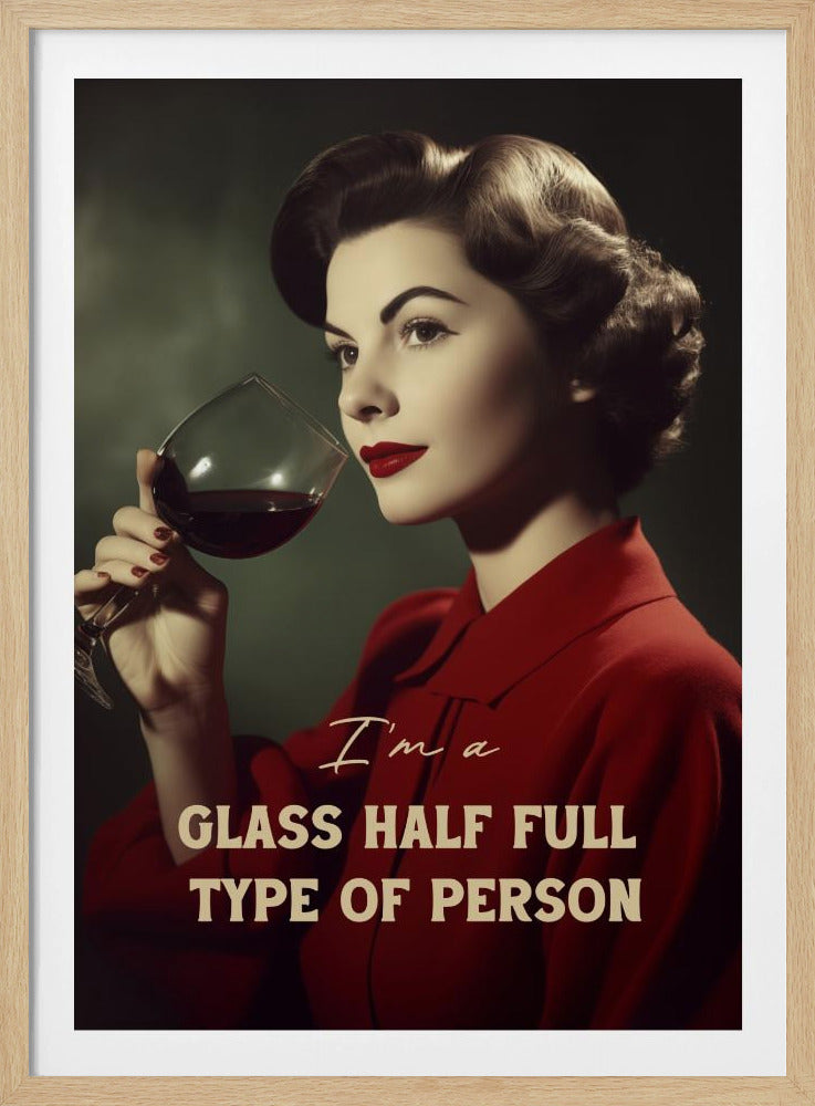 A vintage-style poster featuring a glamorous woman with dark, styled hair, red lipstick, and a red dress. She holds a large glass of red wine, looking off to the side with a pensive expression. The text below her reads 'I'm a GLASS HALF FULL TYPE OF PERSON'. Wall Art