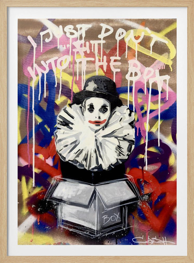 A framed street art style painting of a mime in black and white with a large ruffled collar emerging from a cardboard box. The background is covered in colorful graffiti, and the text 'Just don't fit into the box' is written in white dripping paint at the top. Artwork