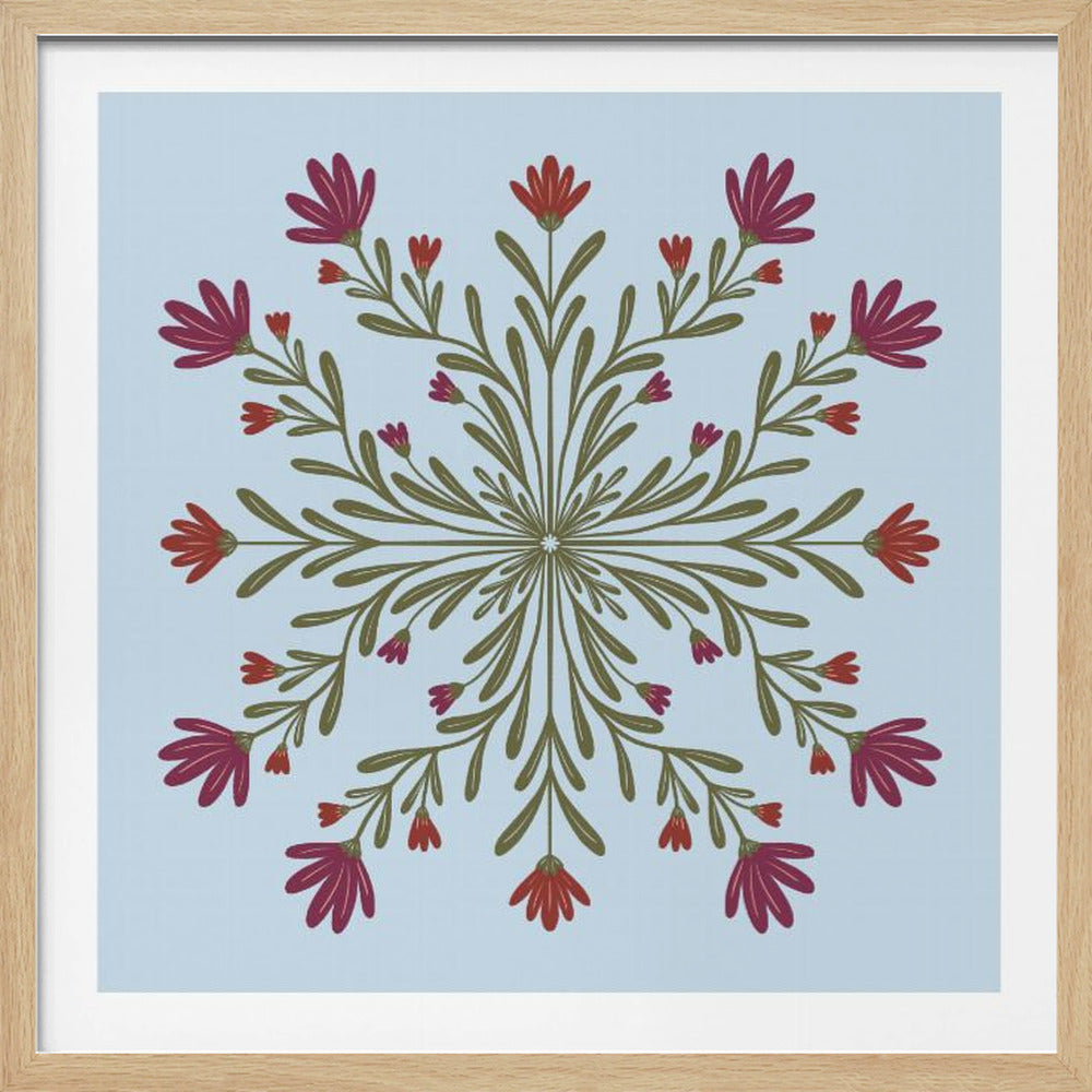 A framed art print with a symmetrical floral mandala on a light blue background. Olive green stems and leaves radiate from the center, blooming with magenta and red flowers. The artwork is enclosed in a light wood frame. Wall Art
