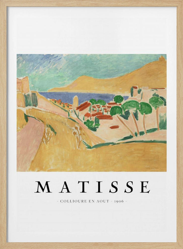 A poster featuring Henri Matisse's 1906 painting, 'Collioure en Aout'. The Fauvist artwork depicts a vibrant coastal landscape with yellow hills, a seaside village with red roofs, green trees, and a blue and turquoise sea. The poster has a black frame and white border with the artist's name and title underneath. Artwork