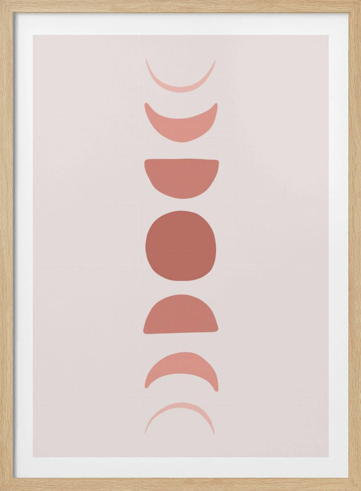 A minimalist art print in a black frame, featuring a vertical column of terracotta-colored shapes that represent the phases of the moon, from waxing crescent to full moon and back to waning crescent, set against a pale pink background. Wall Art