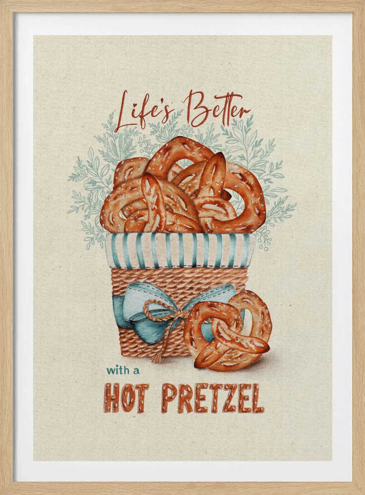 A vintage-style framed artwork featuring a watercolor illustration of a wicker basket overflowing with golden-brown pretzels. The text reads 'Life's Better with a HOT PRETZEL' in a warm brown font against a cream-colored textured background. A blue ribbon is tied around the basket, and light blue foliage is visible behind it. Poster