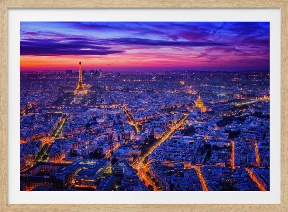 An aerial panoramic view of Paris at dusk, with the cityscape illuminated in cool blue and warm yellow lights. The Eiffel Tower is prominently lit on the left under a dramatic sunset sky transitioning from orange and pink to deep purple. Poster