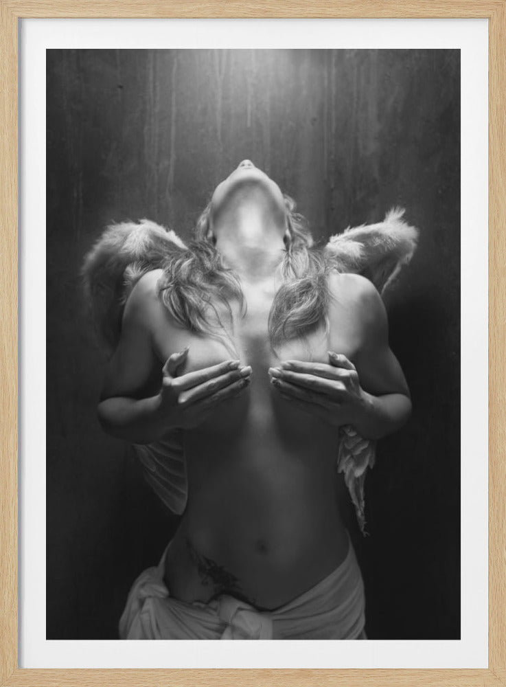 A dramatic black and white photograph of a topless woman with angel wings, her head tilted back towards a light from above. She is covering her breasts with her hands, and a white cloth is draped around her hips. Poster