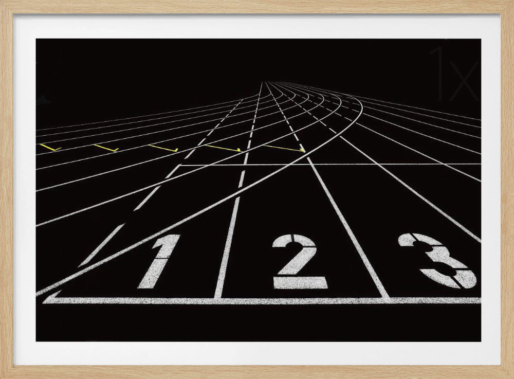A framed, high-contrast graphic of a black running track from a low-angle perspective at the starting line. White lines delineate the lanes, with the numbers 1, 2, and 3 stenciled in the foreground. The track curves and recedes into the distance, creating a strong sense of perspective. Decor