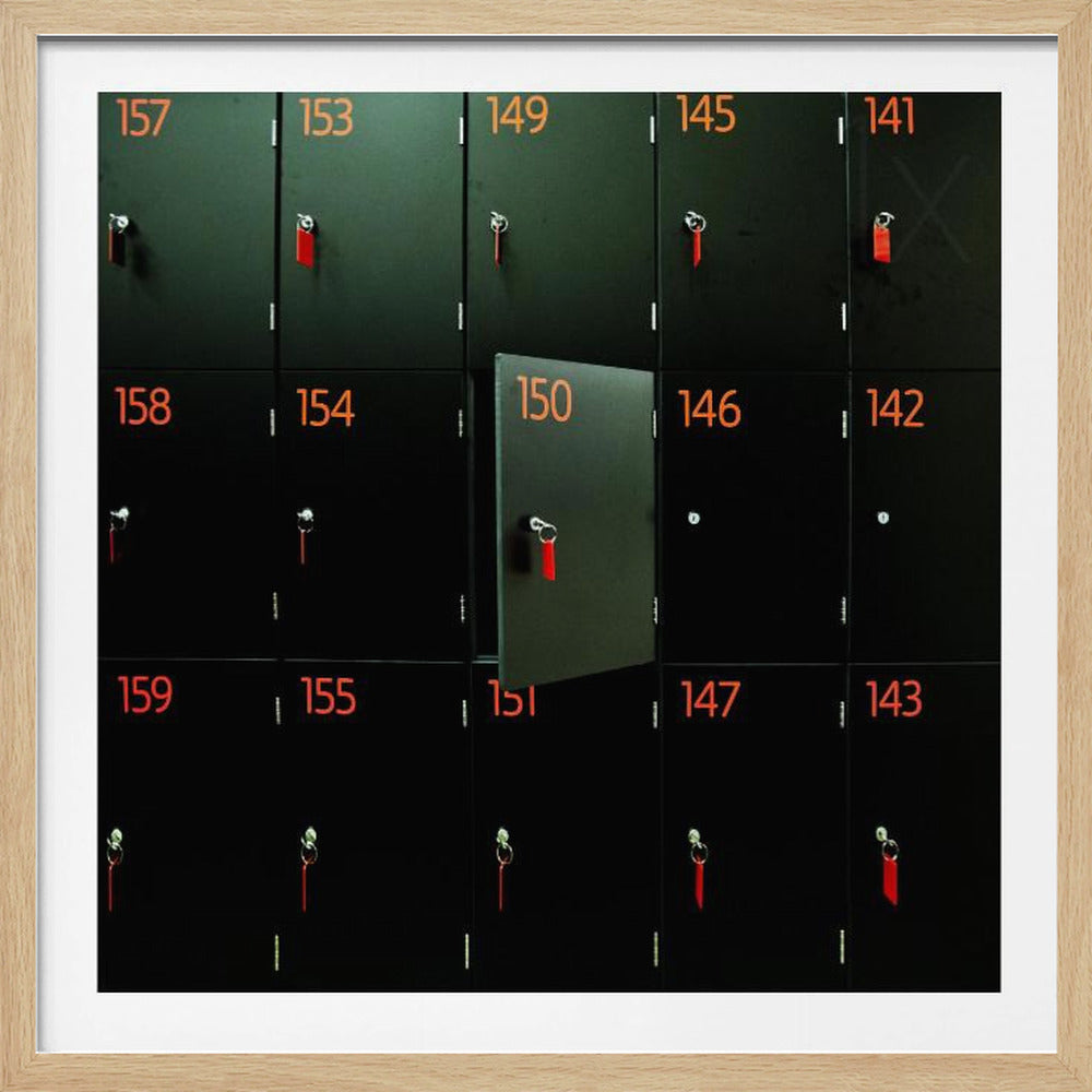 A head-on shot of a grid of black lockers inside a light wood frame. Each locker has a bright orange number and a key with a red tag. Locker number 150 is open, creating a focal point in the otherwise uniform pattern. Wall Art