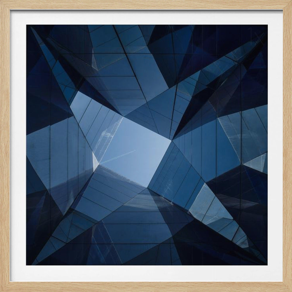 A framed, low-angle photograph looking up towards the sky, surrounded by the reflective blue glass facades of modern buildings which create a kaleidoscopic, geometric pattern. Print