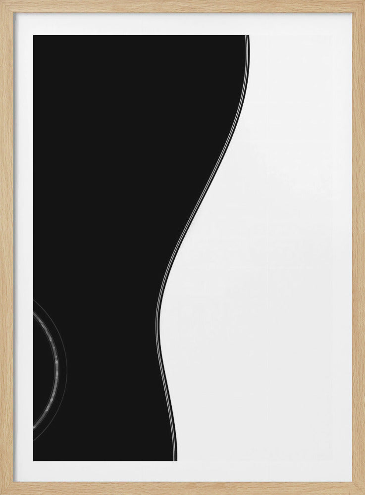 A minimalist black and white abstract photograph showing the elegant S-curve of an acoustic guitar's body. The composition is split vertically by this curve, with the black guitar on the left and a plain white background on the right, enclosed in a black frame. Artwork