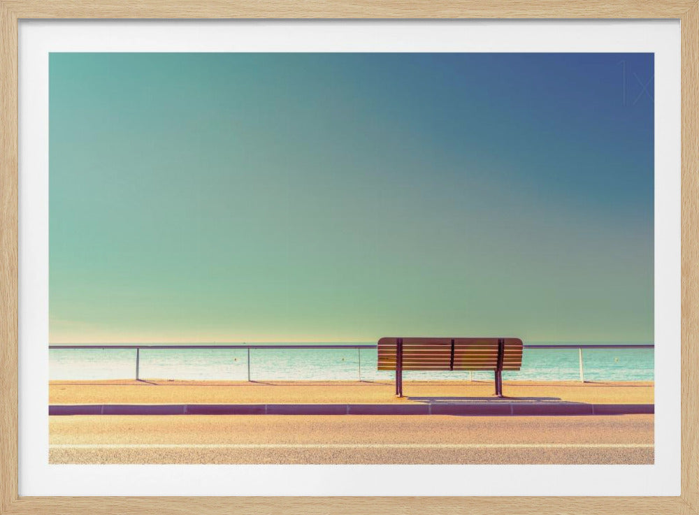 A minimalist, retro-toned photograph of a solitary wooden bench on a sunlit seaside promenade, overlooking a calm turquoise ocean under a vast, clear blue-green sky. Poster
