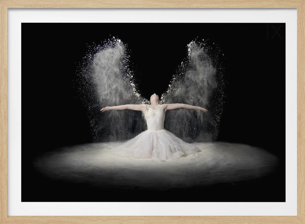 A ballerina in a white tutu sits on a floor covered in white powder against a black background. With her arms outstretched and head tilted back, she throws the powder into the air, creating two beautiful, wing-like plumes behind her. Poster