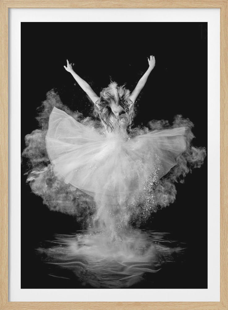 A dramatic black and white photograph of a ballerina in a white tutu with her arms raised. She is surrounded by an explosion of white powder, creating a cloud around her against a solid black background. Her reflection is visible on the floor beneath her. Poster