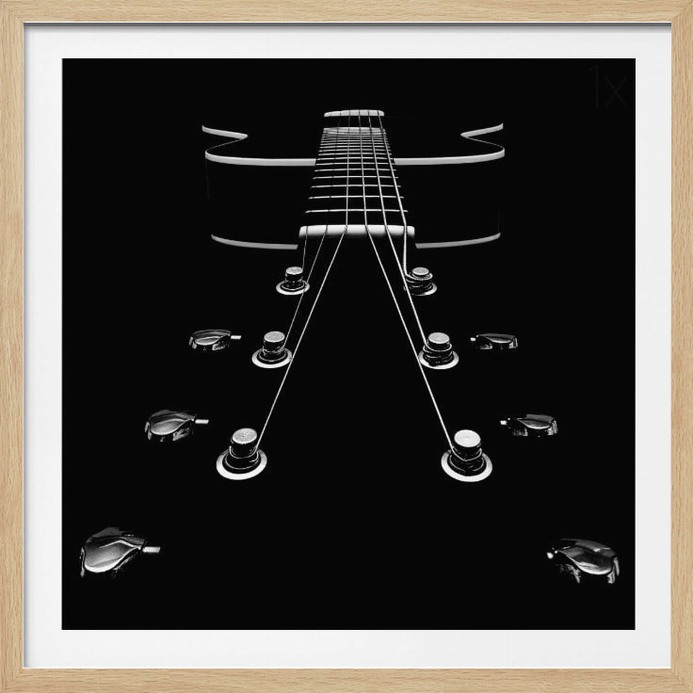 A dramatic, low-angle, black and white photograph of an electric guitar. The perspective looks up from the headstock, with the shiny tuning pegs and strings creating strong leading lines towards the fretboard and body, which are outlined in white against a solid black background. Poster