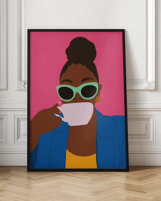 A framed, colorful graphic illustration of a stylish Black woman with her hair in a top bun, wearing mint green sunglasses and a blue blazer, drinking from a white coffee cup against a vibrant pink background. Artwork