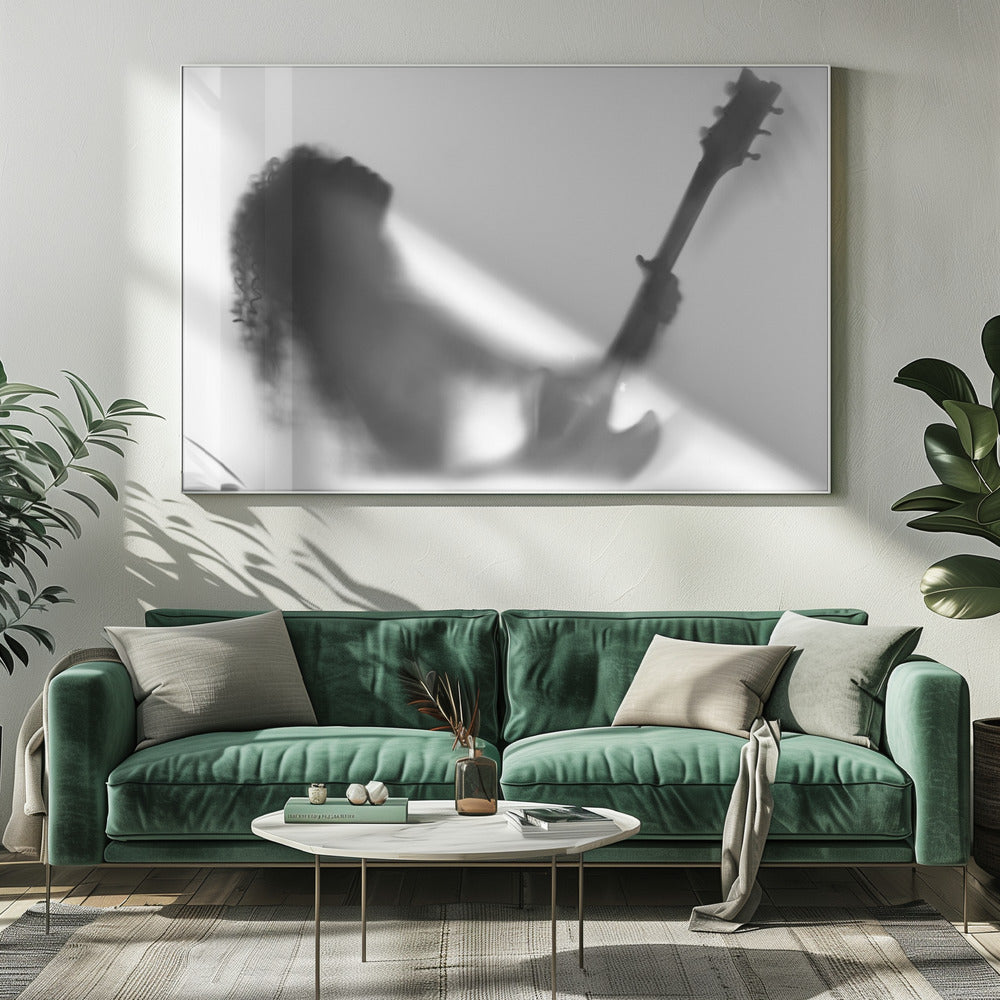 A framed, black and white photograph showing the blurry silhouette of a rock guitarist with long curly hair, head thrown back in passion while holding an electric guitar against a stark white background. Poster
