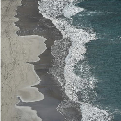 An art print depicting dynamic running ocean waves with white foam and shades of blue and aqua water. Decor