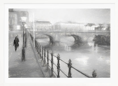 A framed, black and white impressionistic artwork of a city scene on a foggy or rainy day. In the foreground, a dark metal railing runs along a riverside walkway where a person in a dark coat is walking. An arched stone bridge crosses the river in the midground, with hazy buildings visible in the background, creating a moody and atmospheric scene. Wall Art