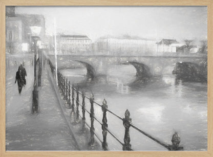 A framed, black and white impressionistic artwork of a city scene on a foggy or rainy day. In the foreground, a dark metal railing runs along a riverside walkway where a person in a dark coat is walking. An arched stone bridge crosses the river in the midground, with hazy buildings visible in the background, creating a moody and atmospheric scene. Wall Art