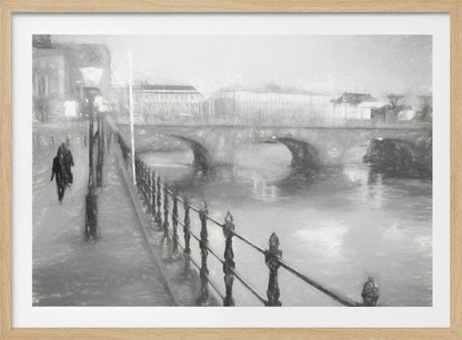 A framed, black and white impressionistic artwork of a city scene on a foggy or rainy day. In the foreground, a dark metal railing runs along a riverside walkway where a person in a dark coat is walking. An arched stone bridge crosses the river in the midground, with hazy buildings visible in the background, creating a moody and atmospheric scene. Wall Art