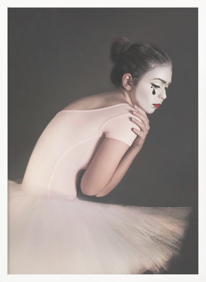 A portrait of a sad ballerina with white mime makeup and a black teardrop painted on her cheek, wearing a pink leotard and white tutu against a dark gray background. Artwork