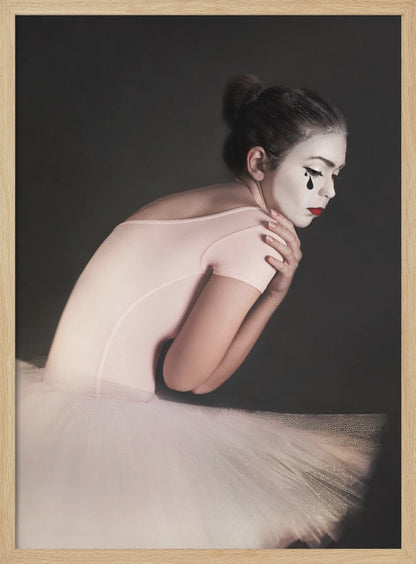 A portrait of a sad ballerina with white mime makeup and a black teardrop painted on her cheek, wearing a pink leotard and white tutu against a dark gray background. Artwork