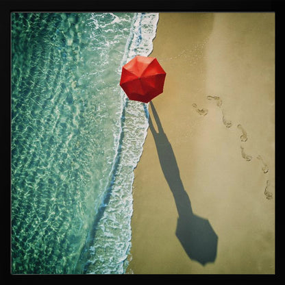 An aerial photograph of a serene beach scene, featuring a vibrant red umbrella on the golden sand next to the clear turquoise ocean. Gentle white waves lap the shore, and a long shadow from the umbrella stretches across the sand, where a trail of footprints leads away. Poster