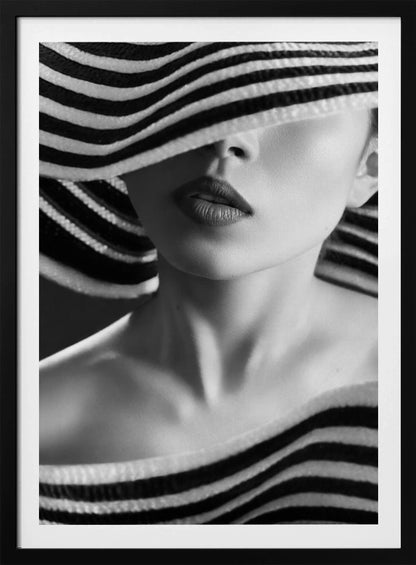 A mysterious black and white close-up portrait of a woman wearing a large, floppy hat with bold black and white stripes. The hat's brim covers her eyes, revealing only her nose, full lips, and chin, creating an elegant and enigmatic look. Decor