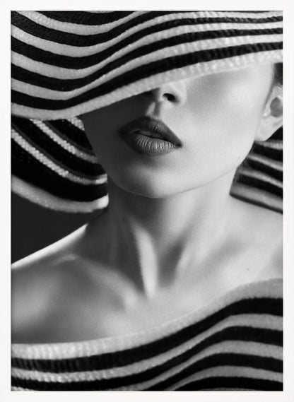 A mysterious black and white close-up portrait of a woman wearing a large, floppy hat with bold black and white stripes. The hat's brim covers her eyes, revealing only her nose, full lips, and chin, creating an elegant and enigmatic look. Decor
