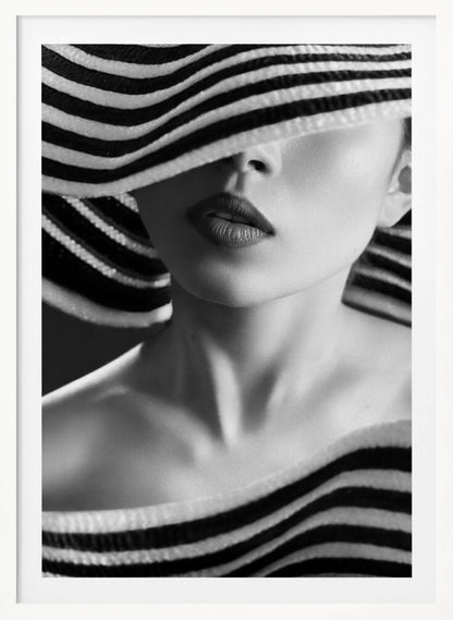 A mysterious black and white close-up portrait of a woman wearing a large, floppy hat with bold black and white stripes. The hat's brim covers her eyes, revealing only her nose, full lips, and chin, creating an elegant and enigmatic look. Decor