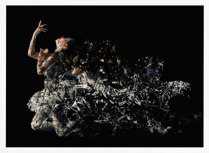 A conceptual piece of artwork depicting a woman in a dynamic pose against a solid black background. Her form appears to be shattering and dissolving into a swirling cloud of broken glass shards, creating a powerful and dramatic effect. The piece is presented within a simple silver frame. Print