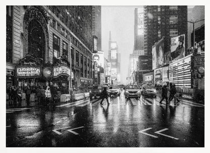A moody black and white photograph of a snowy day in New York City's Times Square. The wet streets reflect the bright lights of the surrounding buildings and billboards as pedestrians cross the street and cars wait in traffic. Artwork